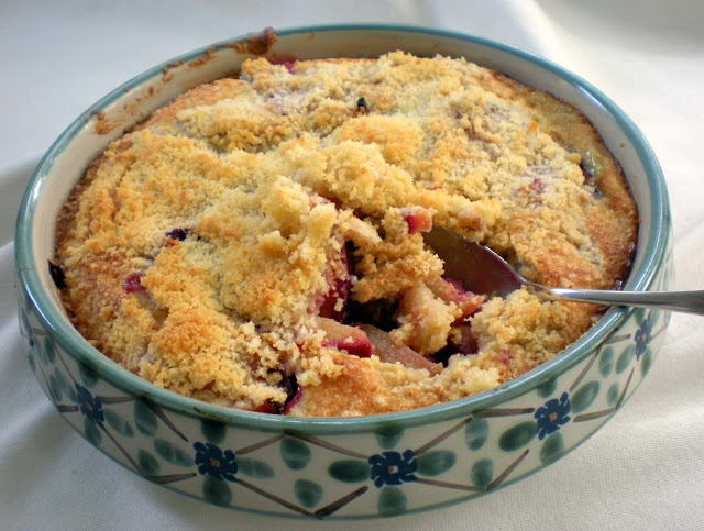 Plum crumble dessert in a ceramic dish