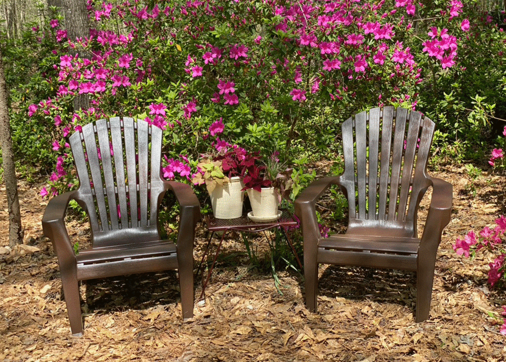 Adirondack chairs in a garden