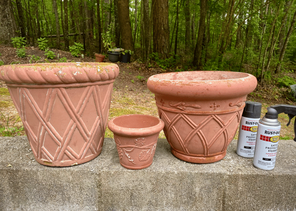 Terra cotta pots and spray paint cans