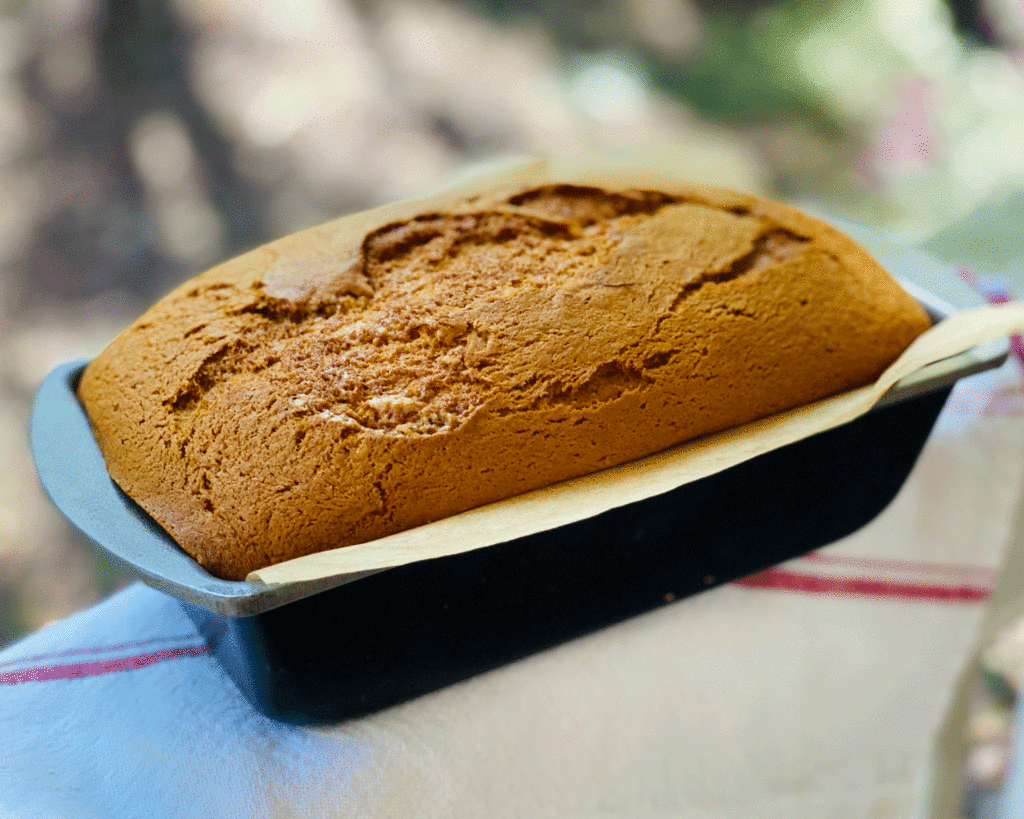 Banana bread in a loaf pan | Photo by Lucy Mercer | A Cook and Her Books