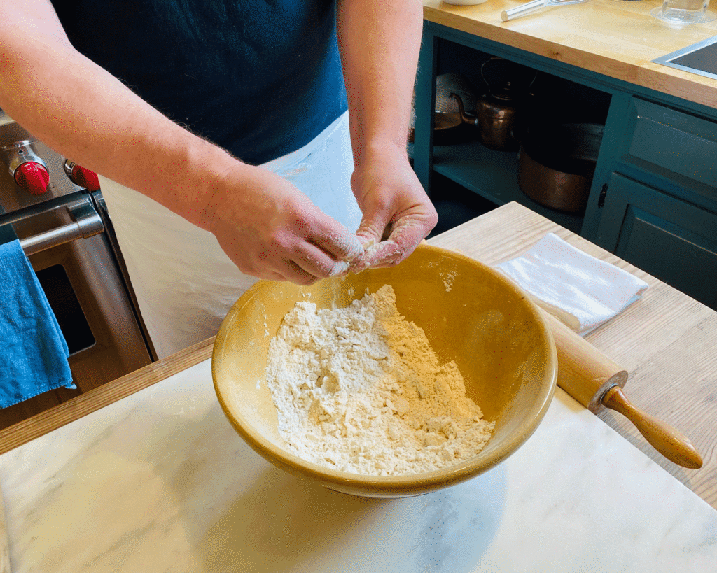 Hands mixing flour and butter | Photo by Lucy Mercer | A Cook and Her Books