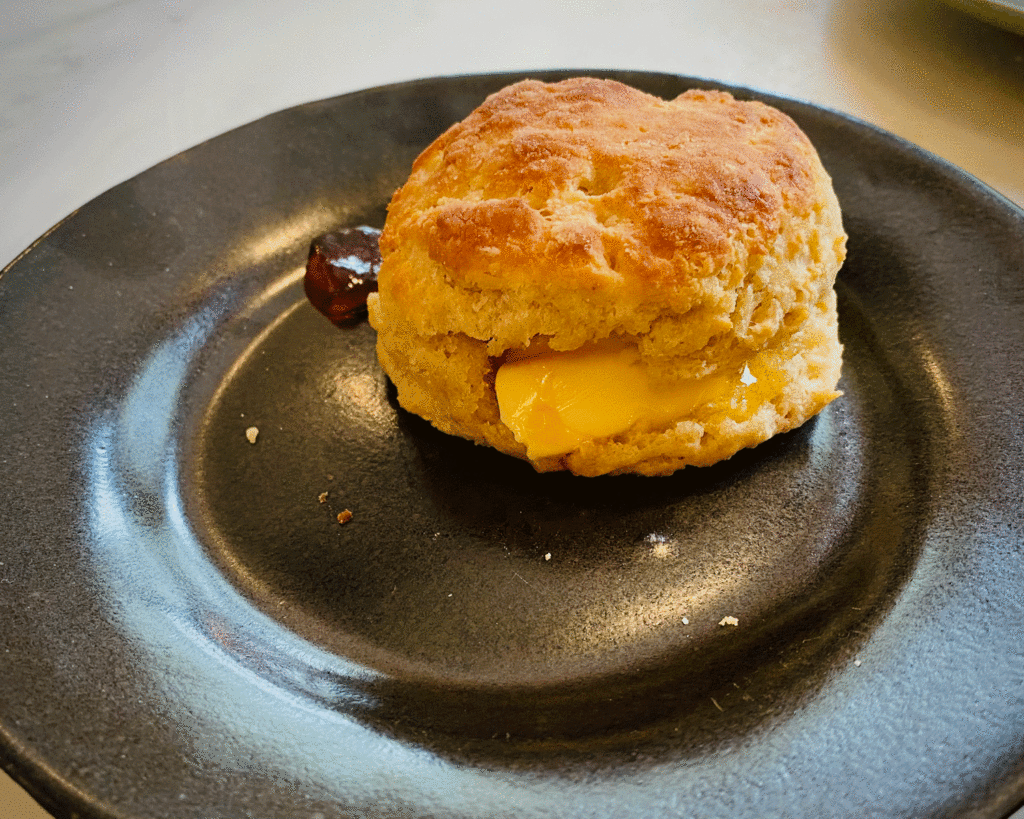 Biscuit on a black plate | Photo by Lucy Mercer | A Cook and Her Books