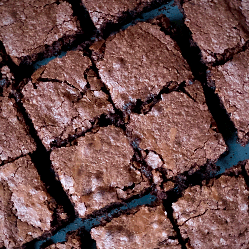 Chocolate brownies cut into squares in a pan
