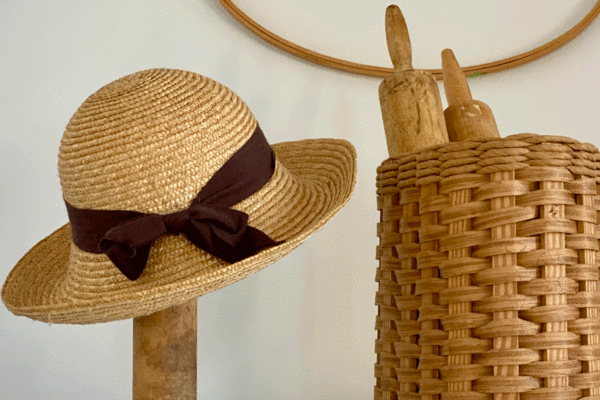 Hat on stand with basket of rolling pins