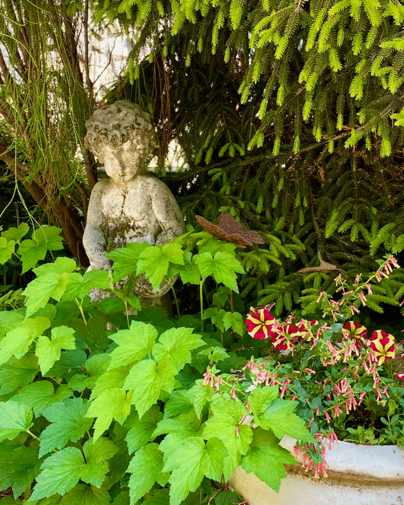 Cherub statue in garden | Photo by Lucy Mercer/A Cook and Her Books