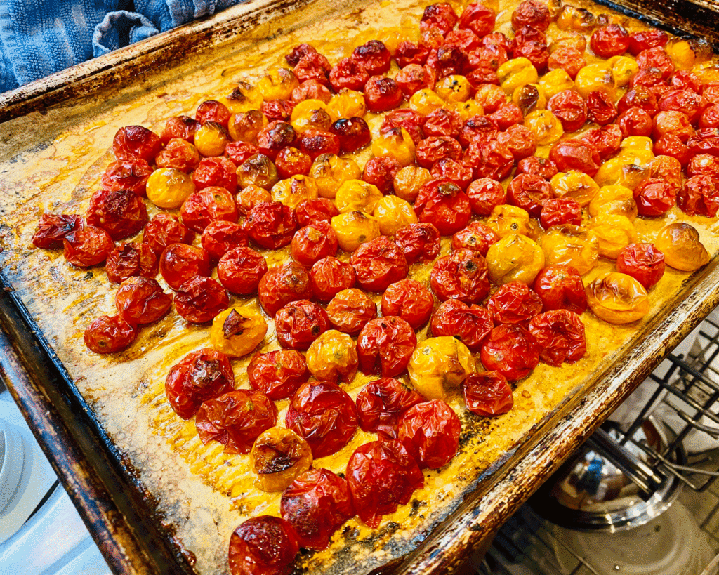 Sheet tray with roasted cherry tomatoes | Photo by Lucy Mercer/A Cook and Her Books