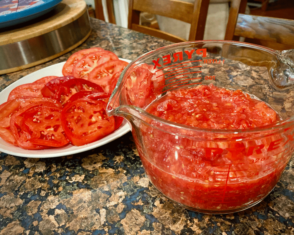 Chopped tomatoes in measuring cup | Photo by Lucy Mercer/A Cook and Her Books