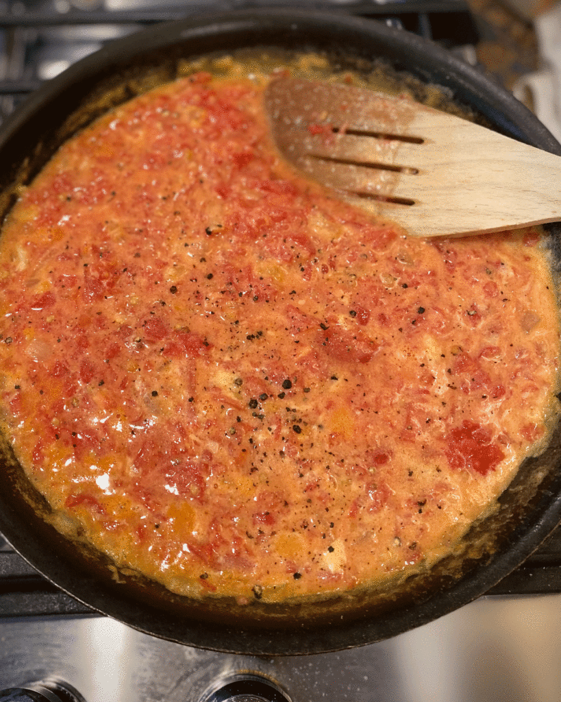 Tomato gravy in skillet | Photo by Lucy Mercer/A Cook and Her Books