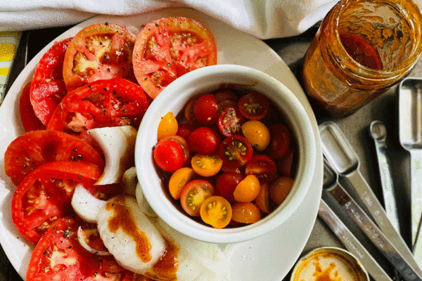 Sliced tomatoes on a plate | Photo by Lucy Mercer/A Cook and Her Books