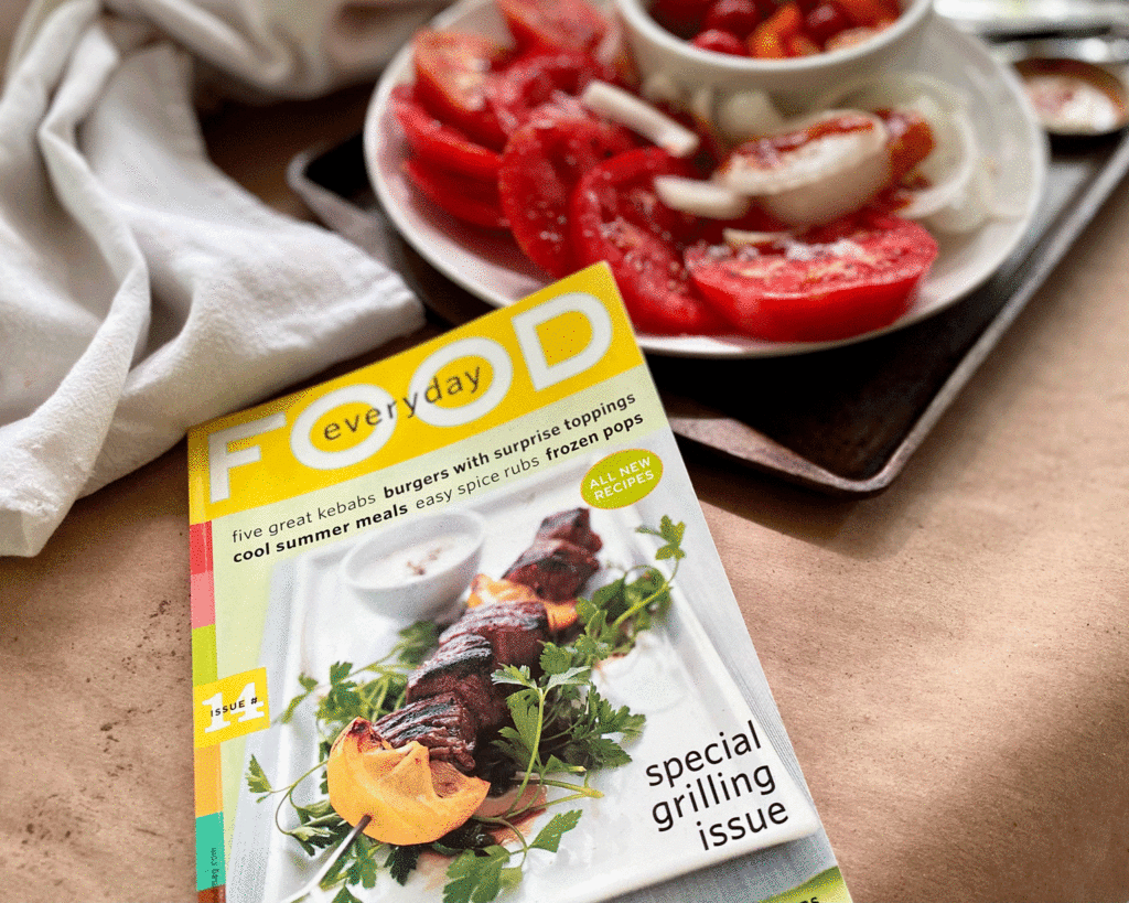 Magazine with tomatoes on plate. Photo by Lucy Mercer/A Cook and Her Books