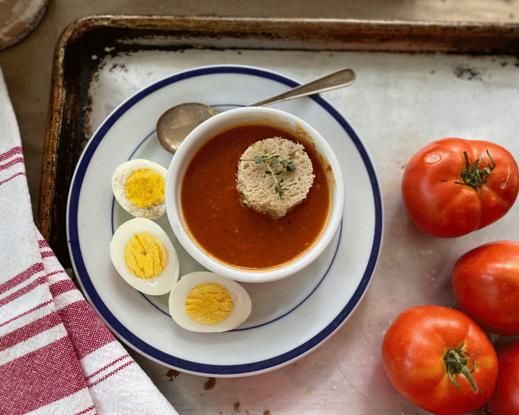 Bowl of tomato soup with tomatoes | Photo by Lucy Mercer/A Cook and Her Books