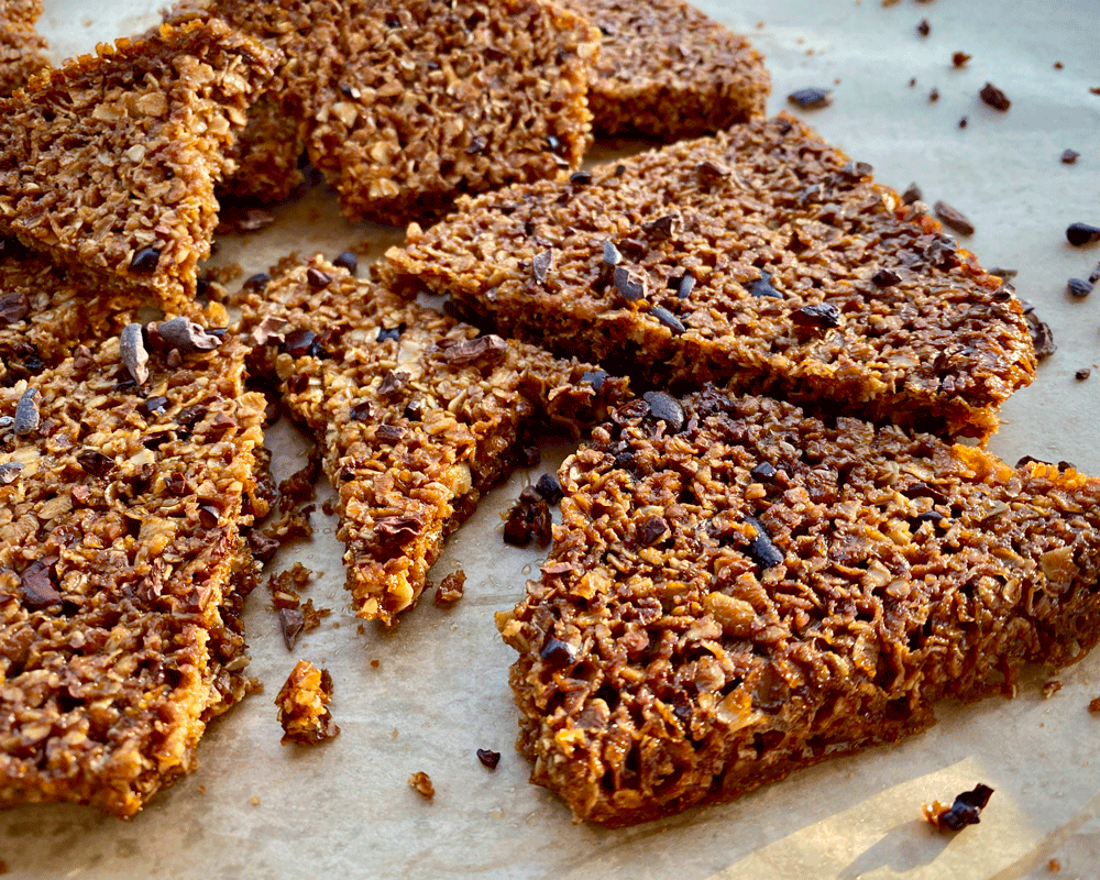 British flapjack cookies with cocoa nibs on a tray