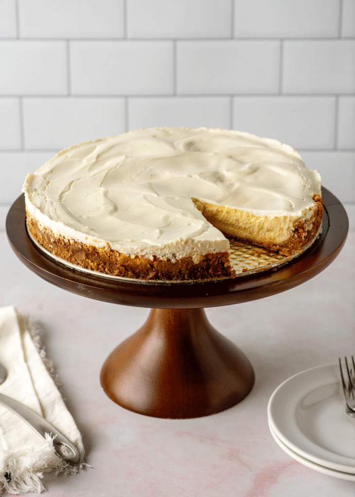 Meyer lemon cheesecake with Biscoff crust on a cake plate