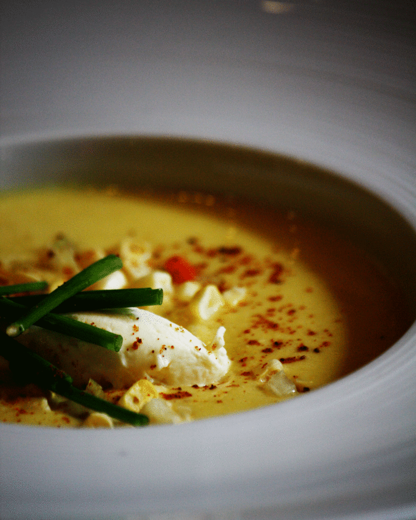 Corn soup in a white bowl