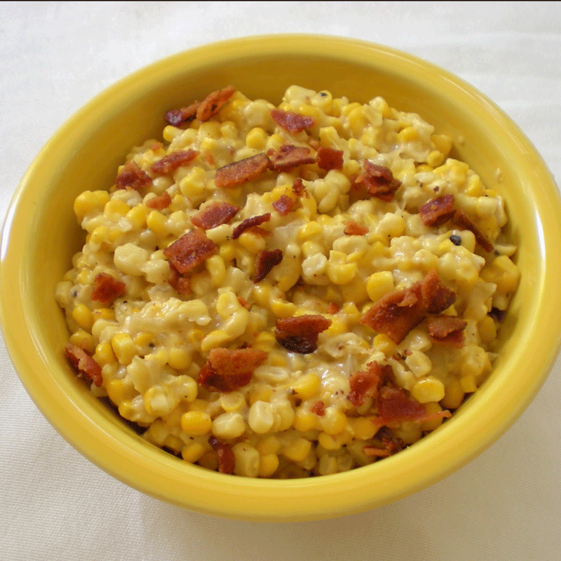 Fried corn with bacon in a yellow bowl