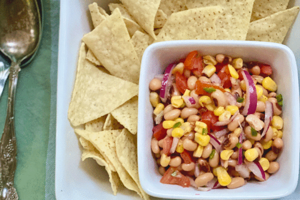 Black eyed pea Cowboy Caviar in a bowl with tortilla chips