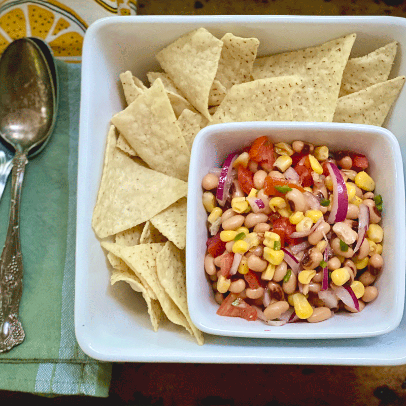 Black eyed pea Cowboy Caviar in a bowl with tortilla chips
