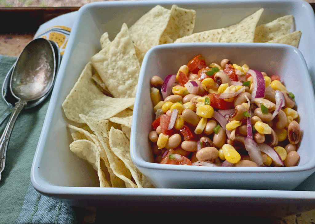 Cowboy caviar with black eyed peas in a bowl with tortilla chips