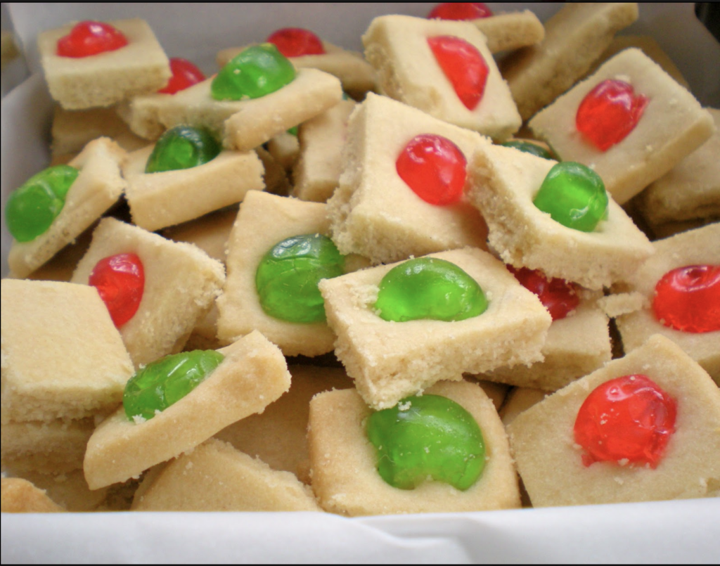 Buttery shortbread cookie squares with red and green candied cherries