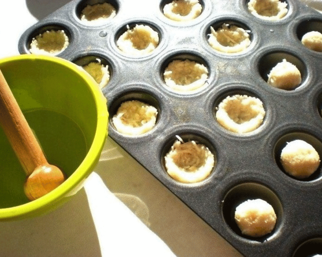 Coconut macaroon shells in a tart pan