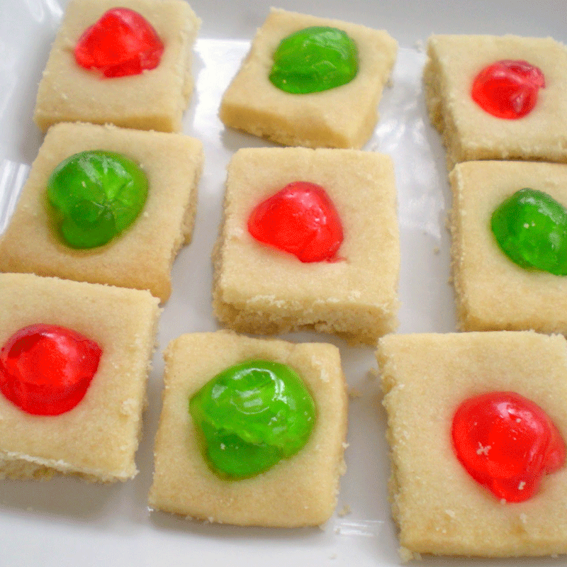 Shortbread squares with red and green candied cherries