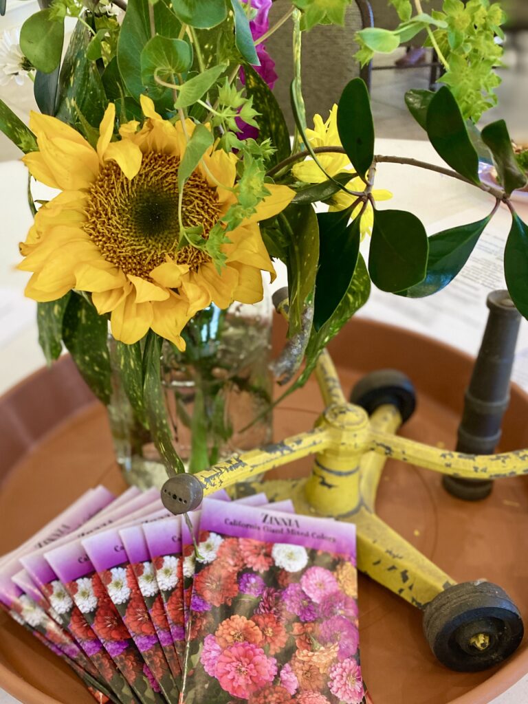 Springtime table centerpiece with sunflower and seed packets