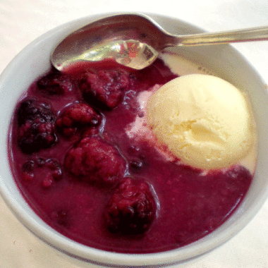 Blackberry doobie dessert with a scoop of ice cream in a bowl