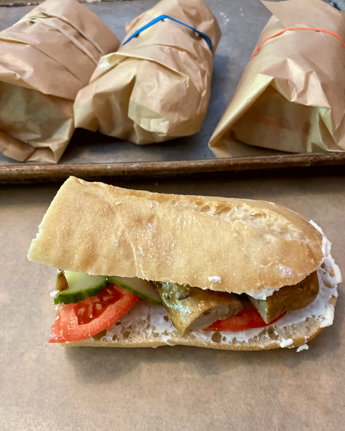 Ukrainian sandwich with sausage, tomato and cucumber
