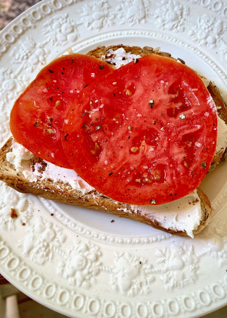 Tomato sandwich on a white plate