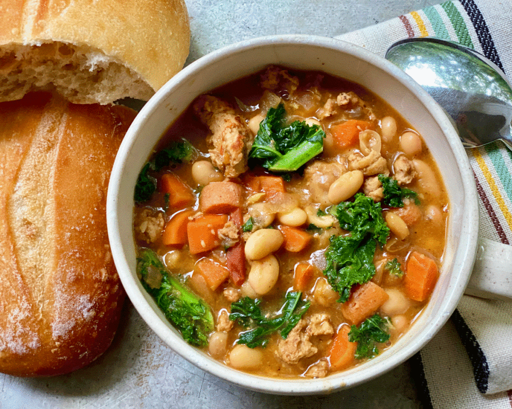 Bowl of bean soup with greens