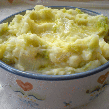 Bowl of colcannon made of mashed potatoes and cabbage