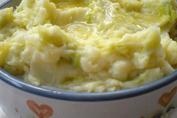 Bowl of colcannon made of mashed potatoes and cabbage
