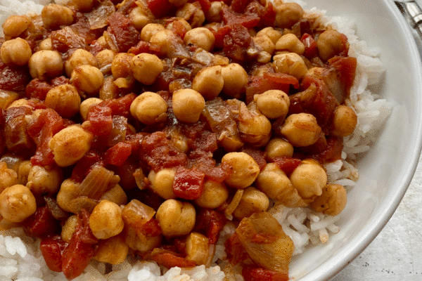 Chickpea curry in a bowl with white rice