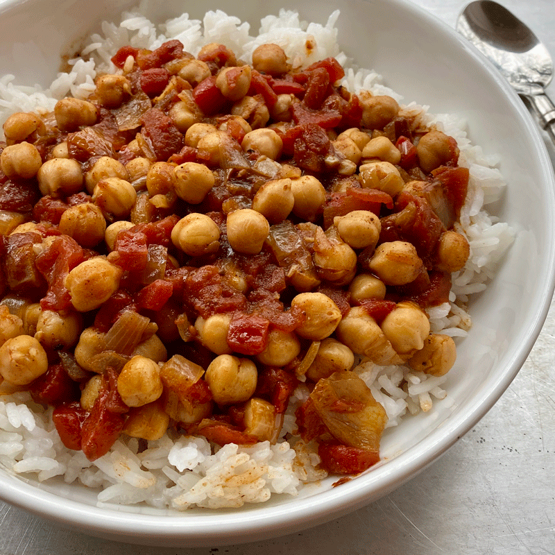 Chickpea curry in a bowl with white rice