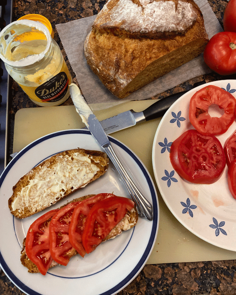 Sliced tomatoes on bread for a tomato sandwich