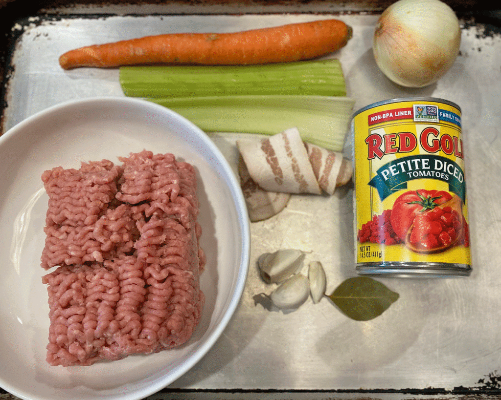 Ingredients for turkey ragu on a sheet tray